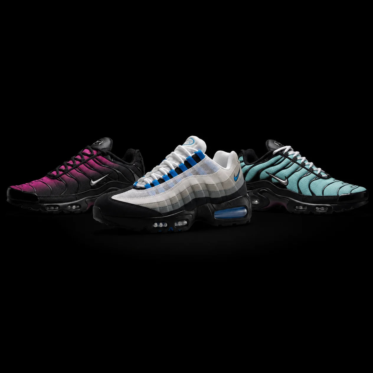 Urban Kinetic Wear — Nike Air Max Plus TN Black Hyper Pink, Air Max 95 OG Blue Spark, and Air Max Plus TN Tiffany trainers on a black studio backdrop
